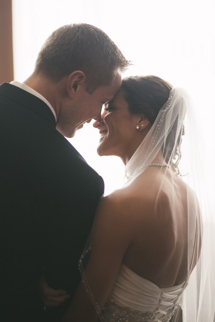 Bride and groom with heads together with Tom Studios Wedding Photography  