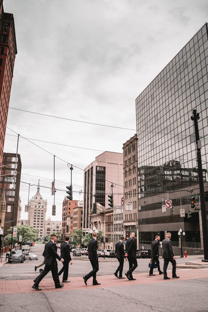 Groom and groomsmen at Sixty State Place crossing