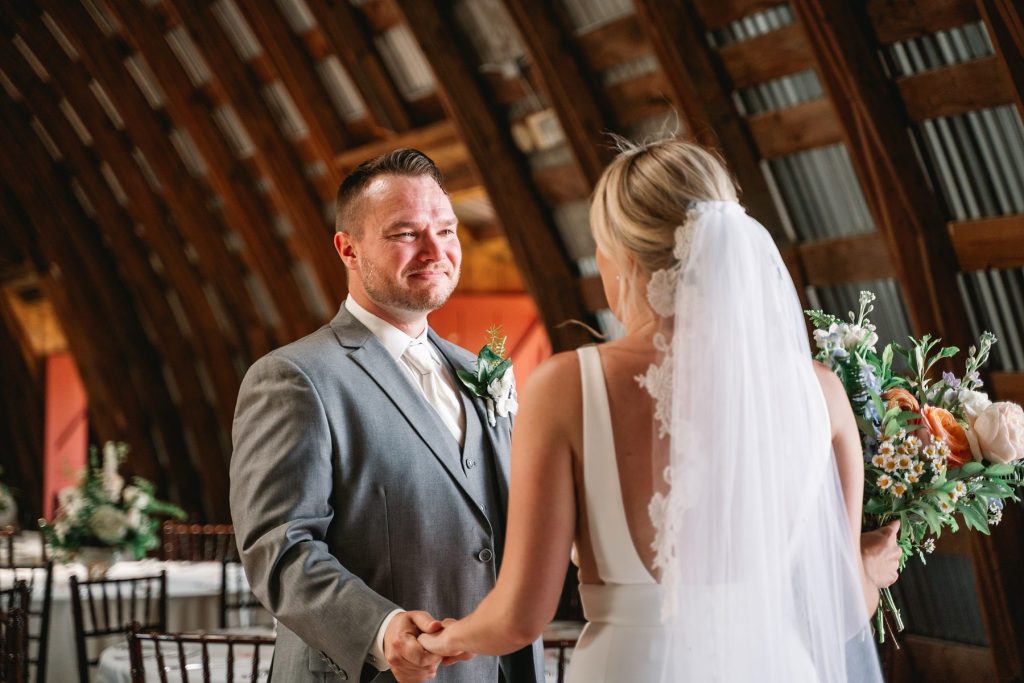 spring hayloft on the arch wedding first look