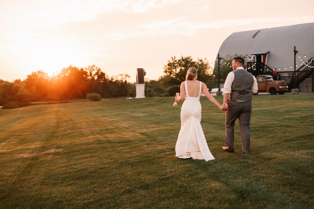 spring hayloft on the arch wedding sunset