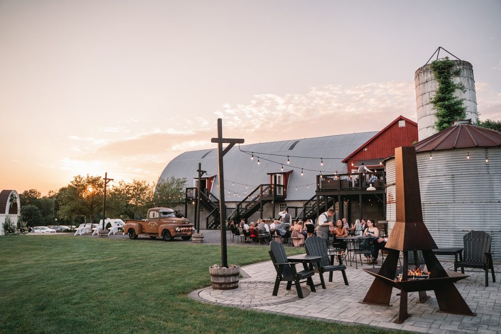 spring hayloft on the arch wedding sunset