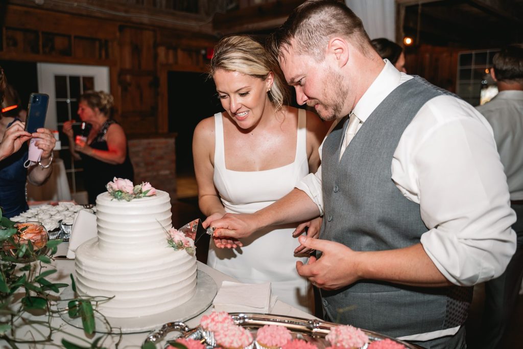 spring hayloft on the arch wedding cake cutting