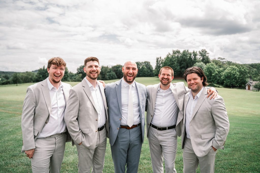 upstate ny barn wedding with bride and groom entourage