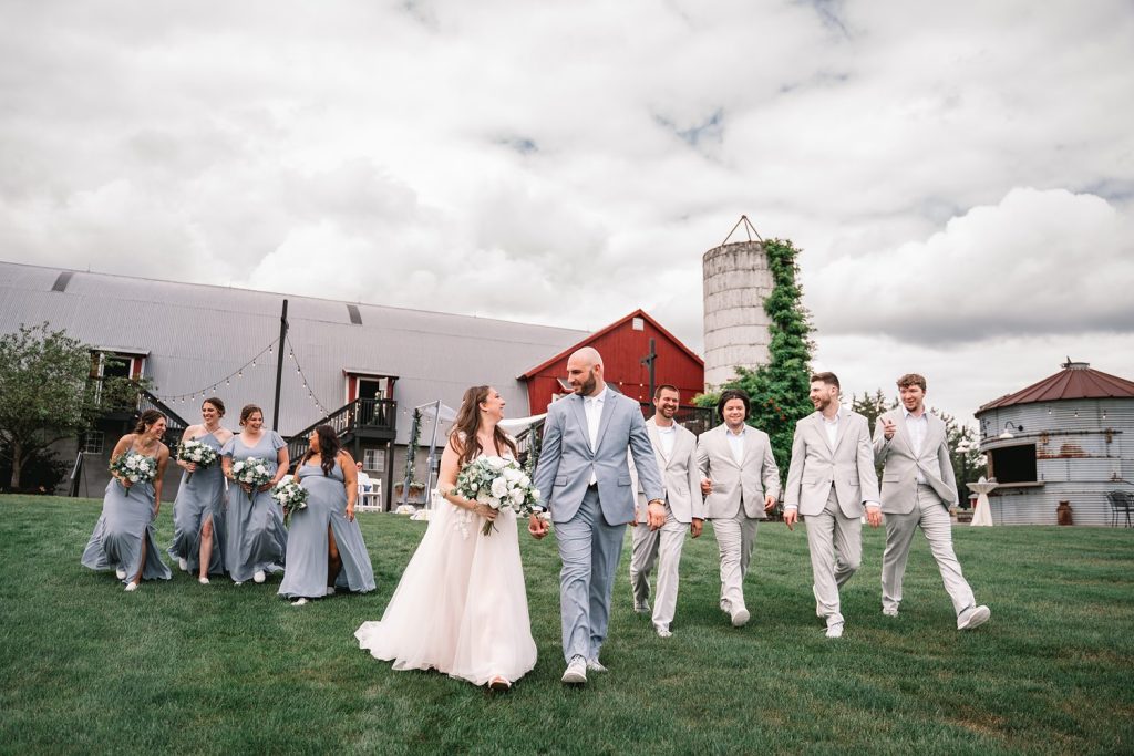 upstate ny barn wedding with bride and groom entourage