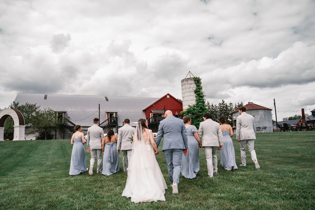 upstate ny barn wedding with bride and groom entourage