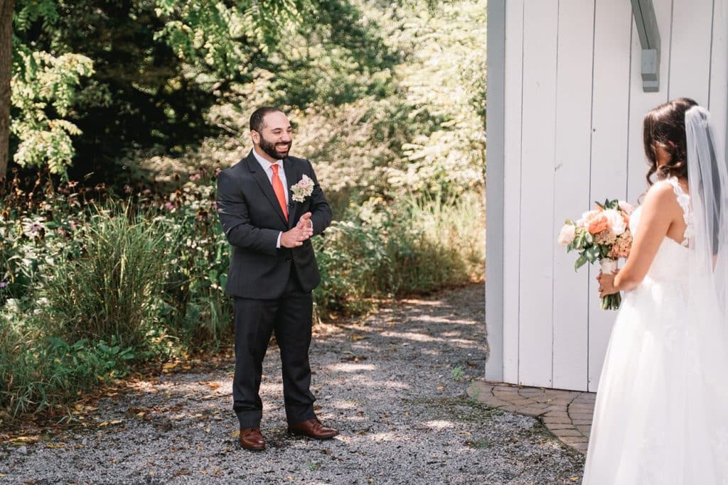 Hayloft on the Arch Summer Wedding bride first look with groom