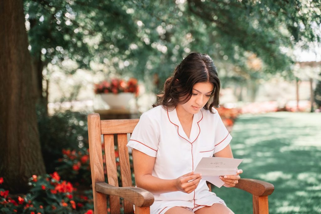 Hayloft on the Arch Summer Wedding bride reading a letter