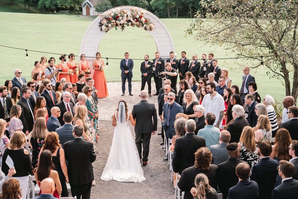 Hayloft on the Arch Summer Wedding ceremony with bride walking down the aisle