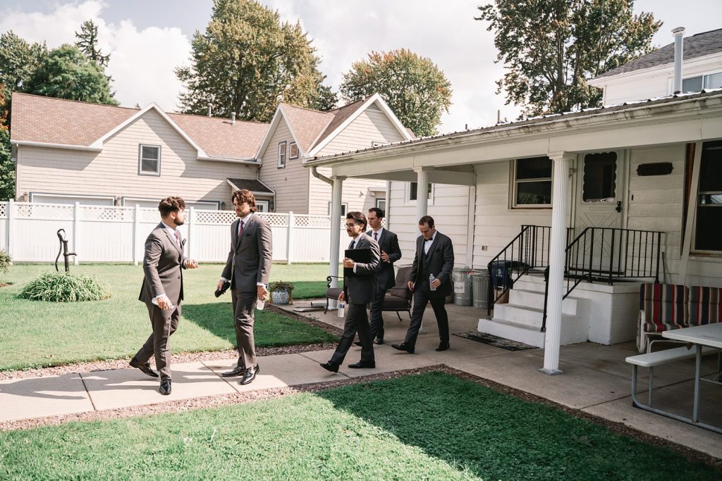 groom getting ready for emerson pavilion wedding in auburn ny